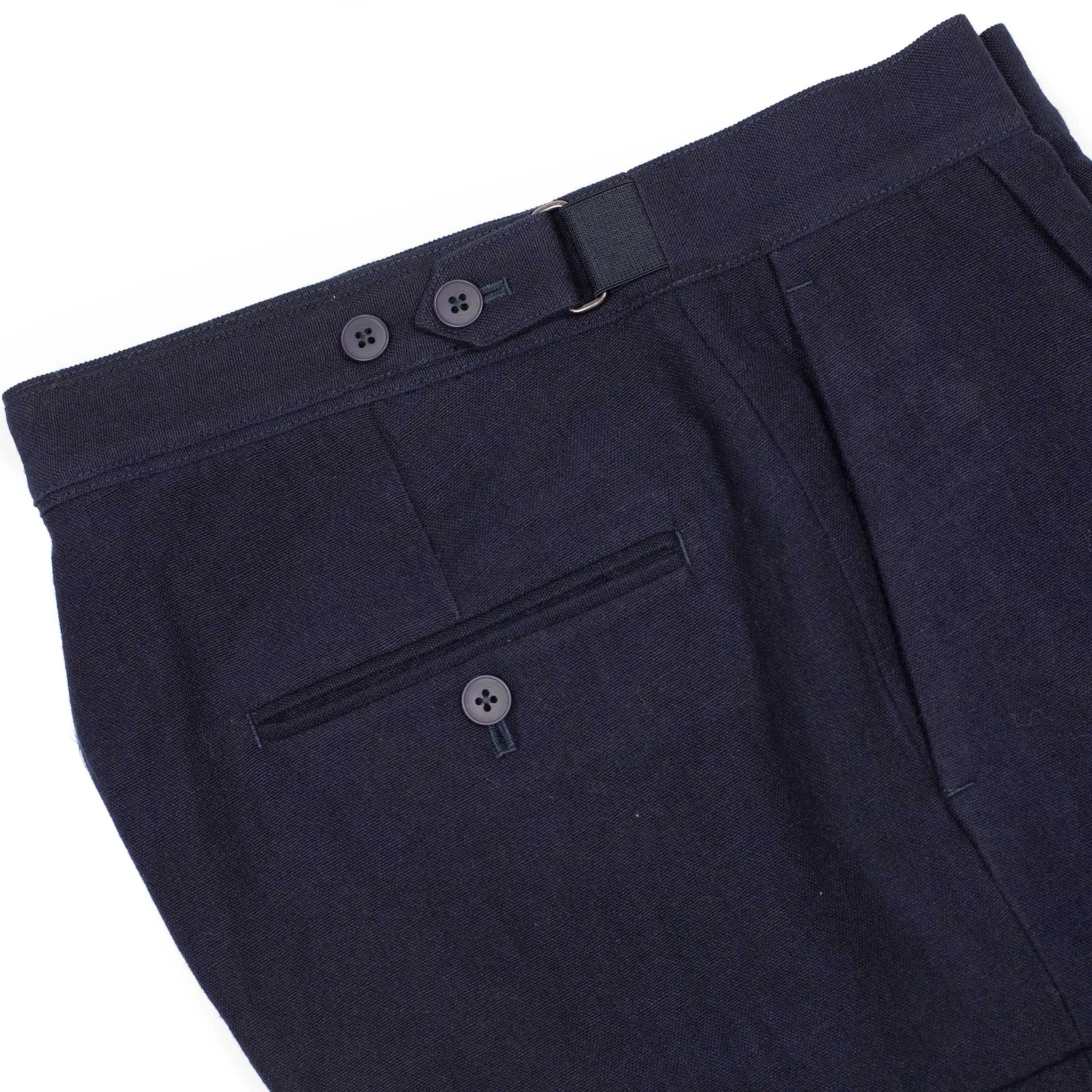 Side tab pleated trousers in dark navy soft wool and linen oxford