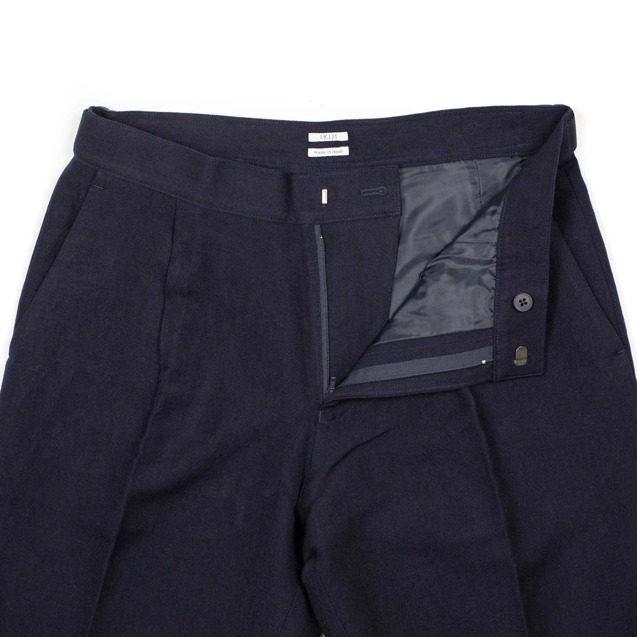 Side tab pleated trousers in dark navy soft wool and linen oxford